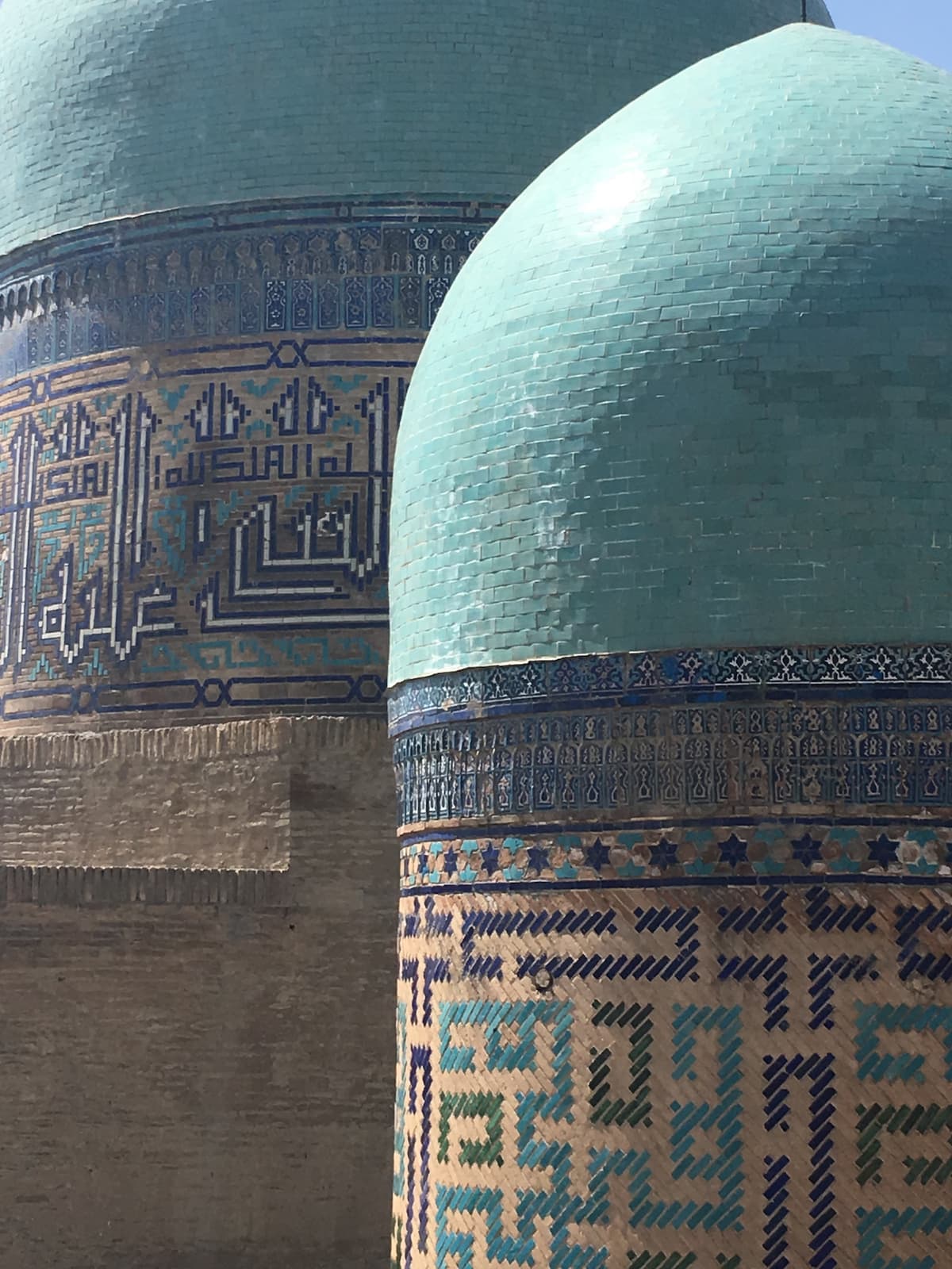 A building is covered in blue and cream mosaics